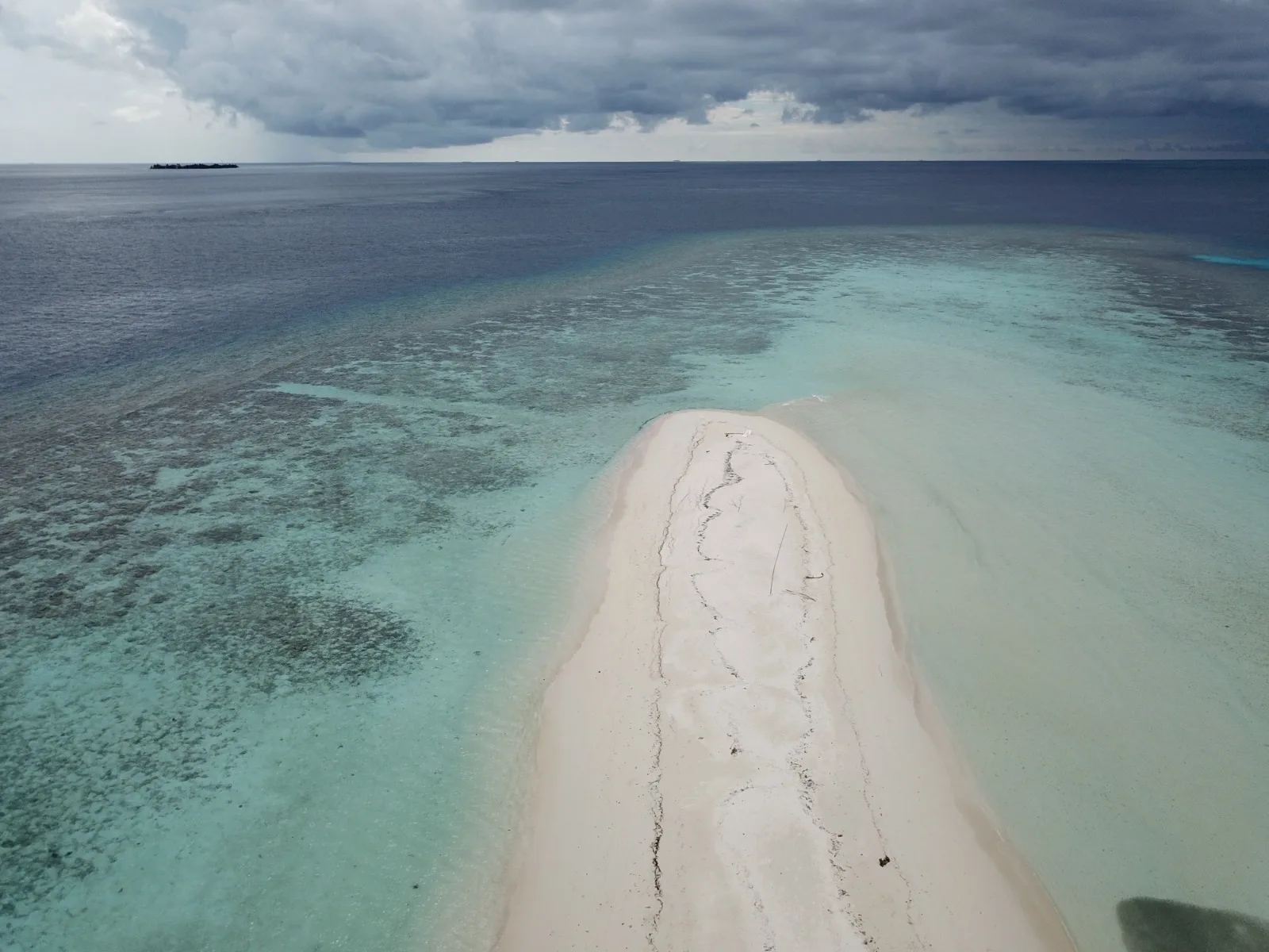 Aerial view of North Malé Atoll, Maldives — The natural opening chapter of an Atoll Villa journey — coral gardens, sandbanks and surf within an easy first afternoon of the airport.