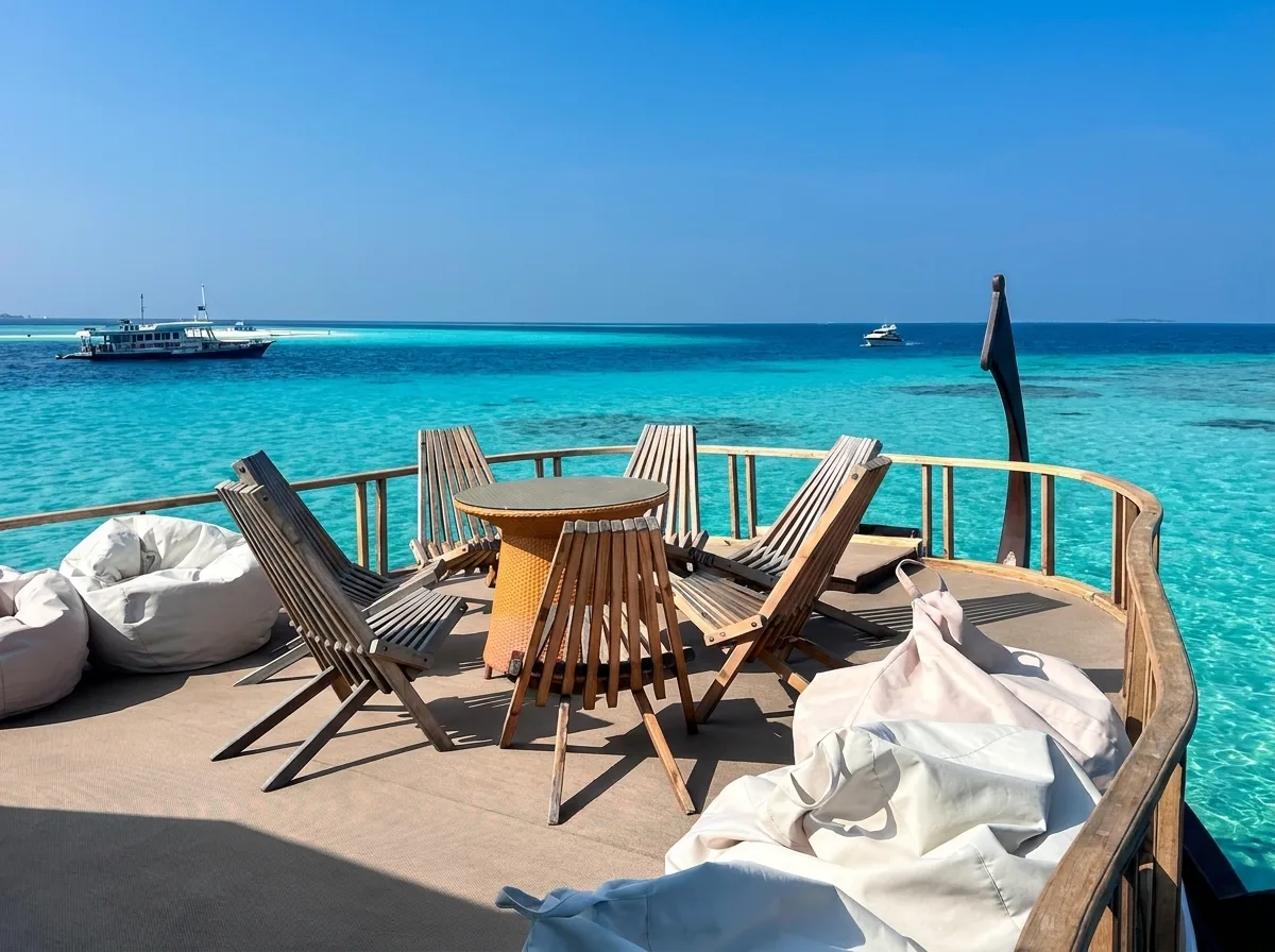 Sundeck jacuzzi and shaded daybeds aboard a luxury Maldives yacht at golden hour
